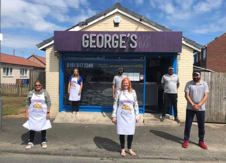 Image of Georges Fish Bar with volunteers standing outside